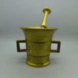 A bronze pestle and mortar