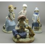 Three Lladro figures and one Nao figure, each depict children with dogs