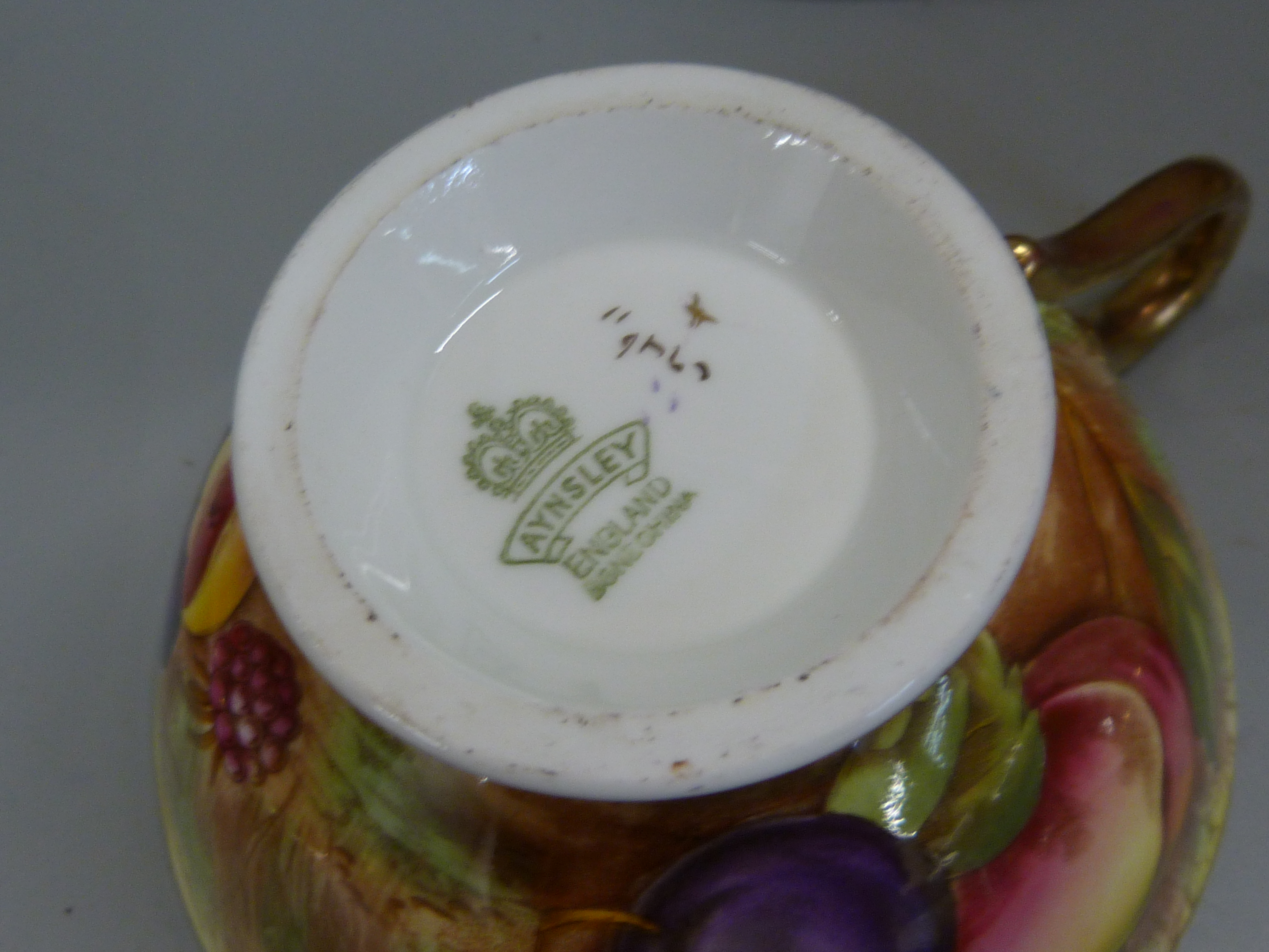 A set of six Aynsley cups, saucers and tea plates, decorated with fruit and berries in gold rim - Image 10 of 13