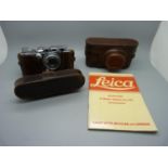 A 1935 Leica III camera with leather case, instruction manual and one other case