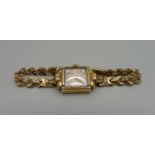 A lady's 9ct gold wristwatch on a 9ct gold bracelet strap, total weight with movement 19.5g