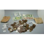 A collection of British coins, banknotes and tokens