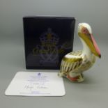 A Royal Crown Derby paperweight - White Pelican, limited edition of 5,000, with gold stopper and red