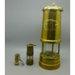 A Hockley Lime and Limelight Company miner's lamp and two miniature miner's lamps