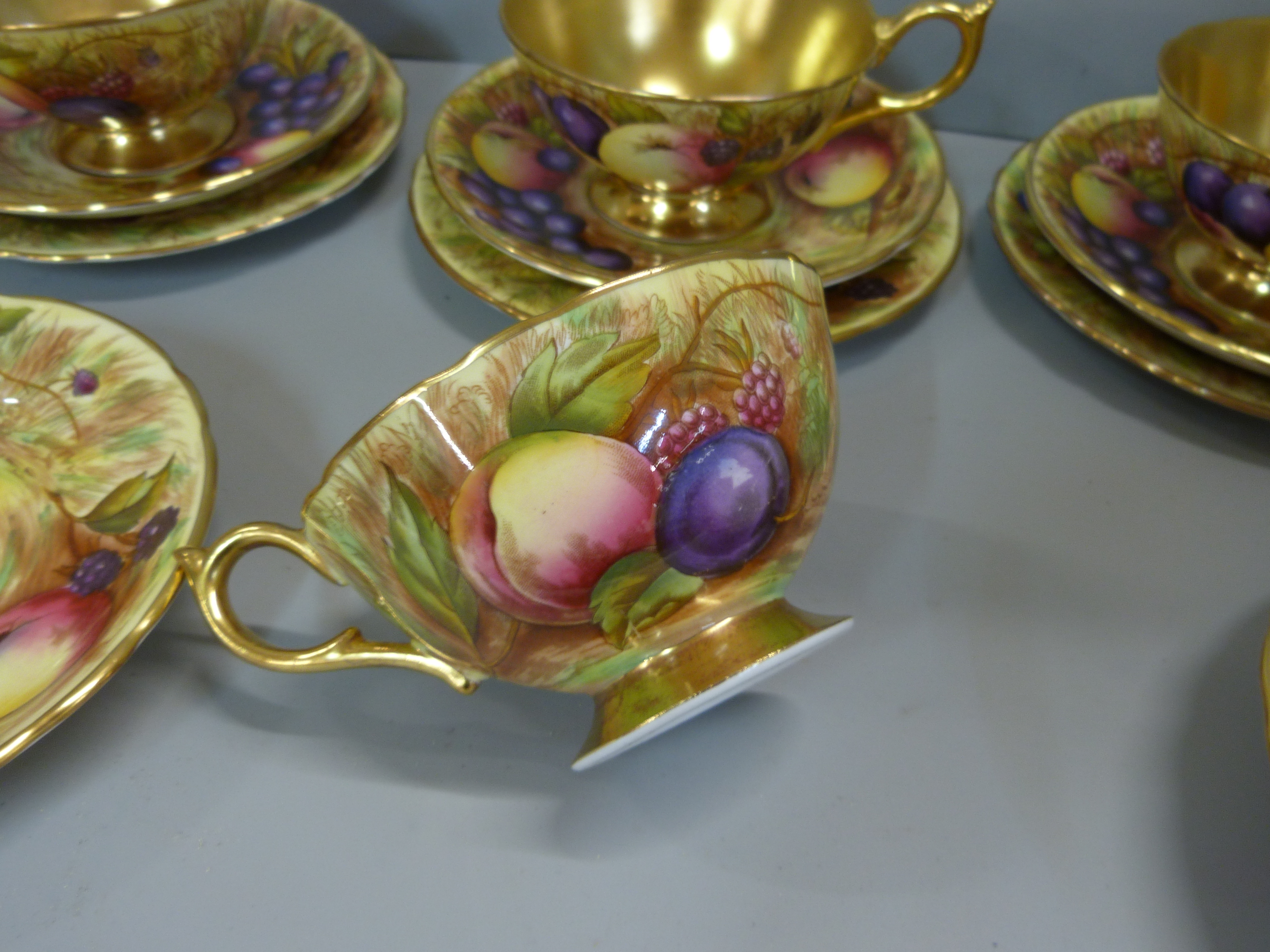 A set of six Aynsley cups, saucers and tea plates, decorated with fruit and berries in gold rim - Image 13 of 13