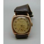 A 9ct gold wristwatch, the dial marked Ocle, 27mm case, the case back bears inscription