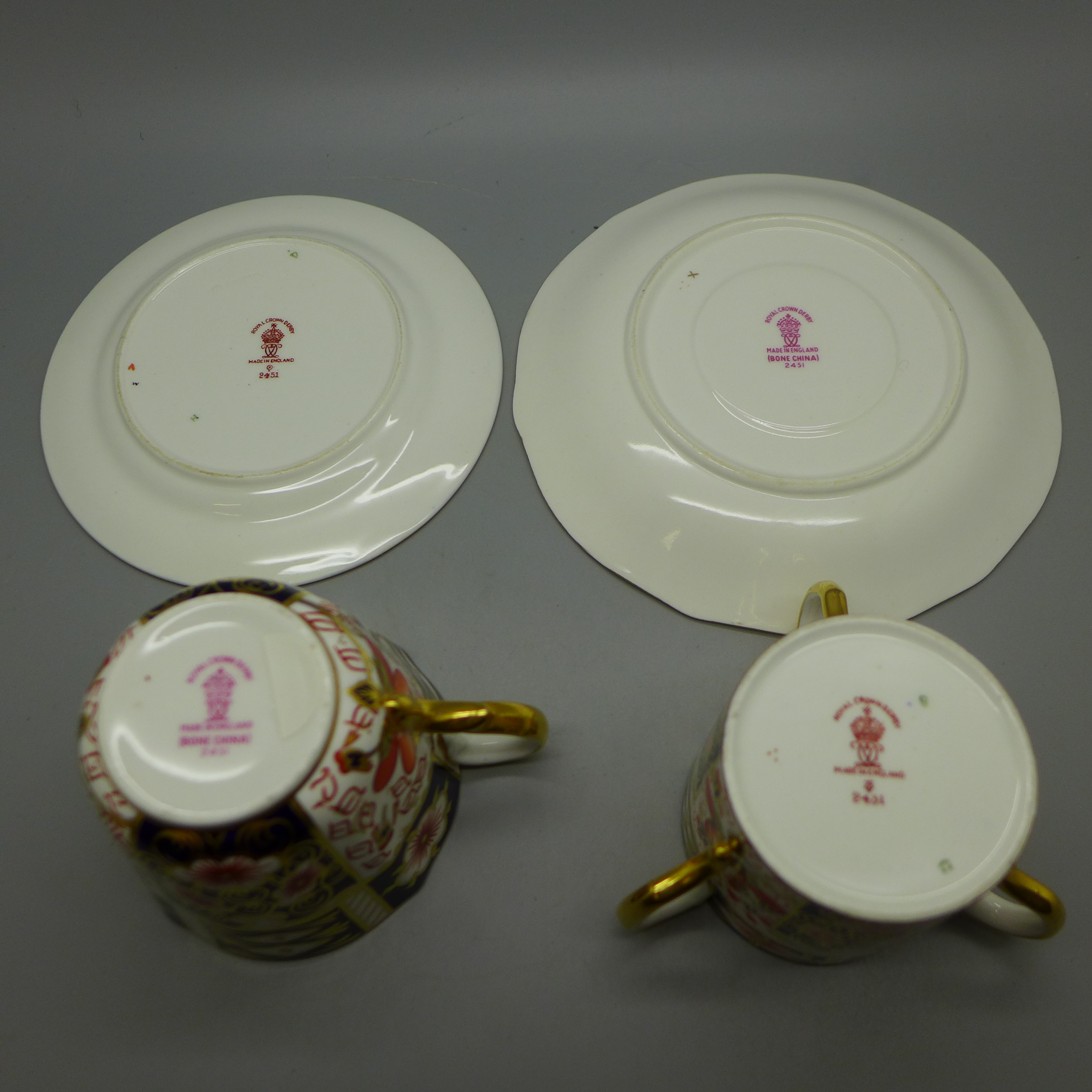 Two Royal Crown Derby Imari cups and saucers, one with three handles - Image 2 of 2