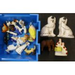 A pair of Staffordshire Spaniels, a pair of greyhounds, one sheep, a Poole Pottery dolphin, an