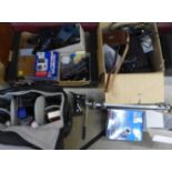 A collection of cameras and accessories including an Olympus camera, a vintage Kodak, Gossan light