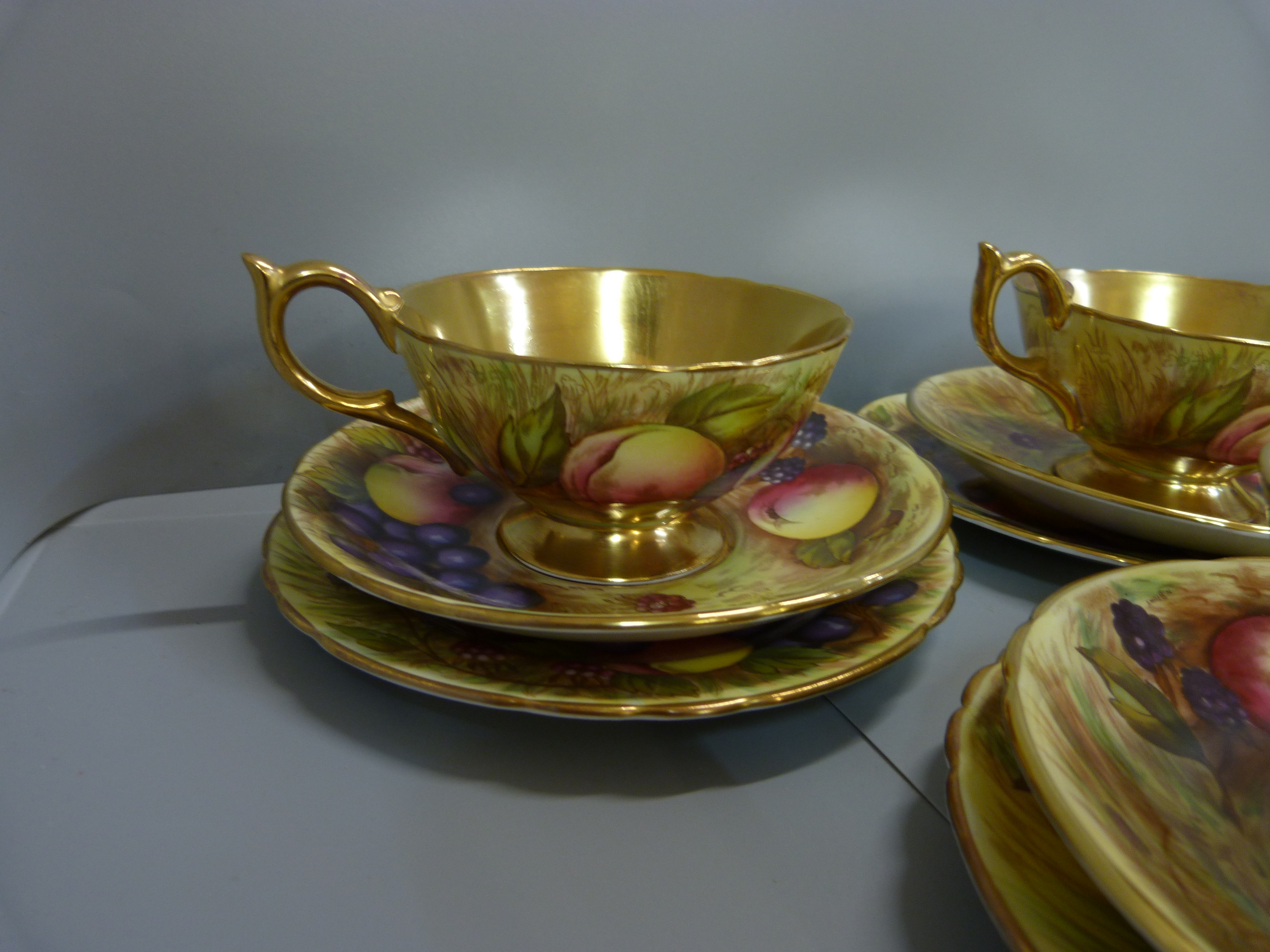 A set of six Aynsley cups, saucers and tea plates, decorated with fruit and berries in gold rim - Image 2 of 13