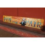 A painted wooden Zippos Fun Fair sign