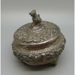 A silver pot with eastern decoration, marked '95% silver', two feet a/f, 91g