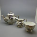 A Collingwood bone china tea set; teapot, cream and sugar