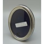 A silver photograph frame, height 10.5cm