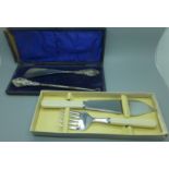 A silver handled shoe horn and button hook and boxed set of fish servers