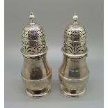 A pair of early 18th Century silver sugar shakers, London mark, 227g, 14cm