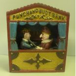 A cast iron Punch and Judy money bank