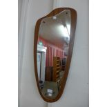 A teak framed mirror