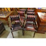 A set of six Regency style mahogany and oxblood leather chairs