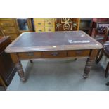 A Victorian mahogany three drawer library table