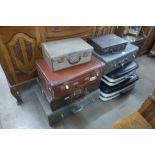 Eight vintage suitcases