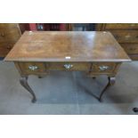 A George I style figured walnut three drawer side table