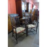 A pair of Arts and Crafts inlaid mahogany elbow chairs