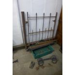 A vintage iron gate with brackets, etc.