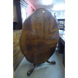 A Victorian mahogany serpentine tilt top centre table