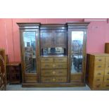 An Edward VII rosewood and marquetry inlaid combination wardrobe