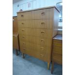 A teak chest of drawers