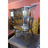 A 19th Century elm and beech comb back Windsor armchair