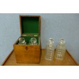 A Victorian mahogany tantalus, with four glass decanters