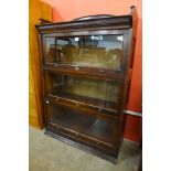 An early 20th Century Lebus oak three tier sectional stacking bookcase