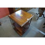 An Edward VII style inlaid mahogany revolving bookcase