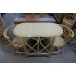 A bamboo and rattan table and two chairs