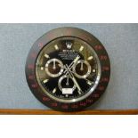 A Rolex style dealer's wall clock