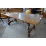 A Spanish walnut and wrought iron refectory table