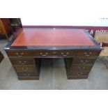 A mahogany and leather topped pedestal desk