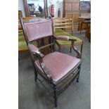 An Edward VII inlaid rosewood elbow chair