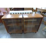 A pair of small teak bookcases