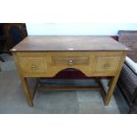 An Arts and Crafts Cotswold School oak three drawer desk