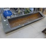 A cast iron feeding trough