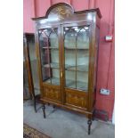 An Edward VII inlaid mahogany display cabinet