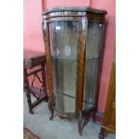 A 19th Century French rosewood and gilt metal mounted serpentine vitrine