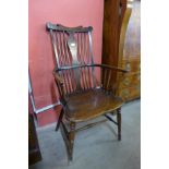 A 19th Century elm and beech comb back Windsor armchair