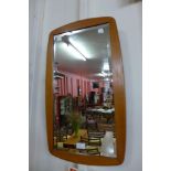 A teak framed mirror