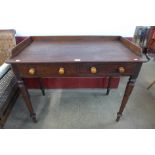 A William IV mahogany two drawer writing table