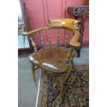 A Victorian elm and beech smokers bow chair