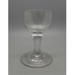 An English plain drawn stem port glass over folded foot and snapped pontil, circa 1765, 83mm